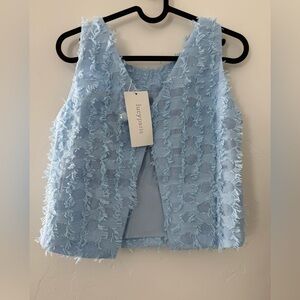 Lucy Paris sold at Bloomingdale’s light blue top New XS